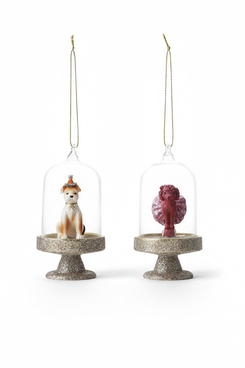 The CREATIVE COOP DOG IN CLOCHE ORNAMENTS feature a red dog and an orange dog in silver glitter bases with gold hanging loops—perfect assorted holiday decor for adding charm to any festive display.