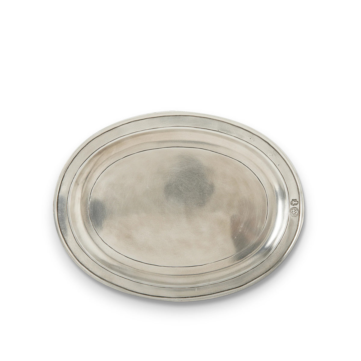 The MATCH - OVAL INCISZED PEWTER TRAY SMALL by MATCH features a smooth, oval pewter design with a slightly raised rim—ideal for engraved gifts, displayed against a white background.