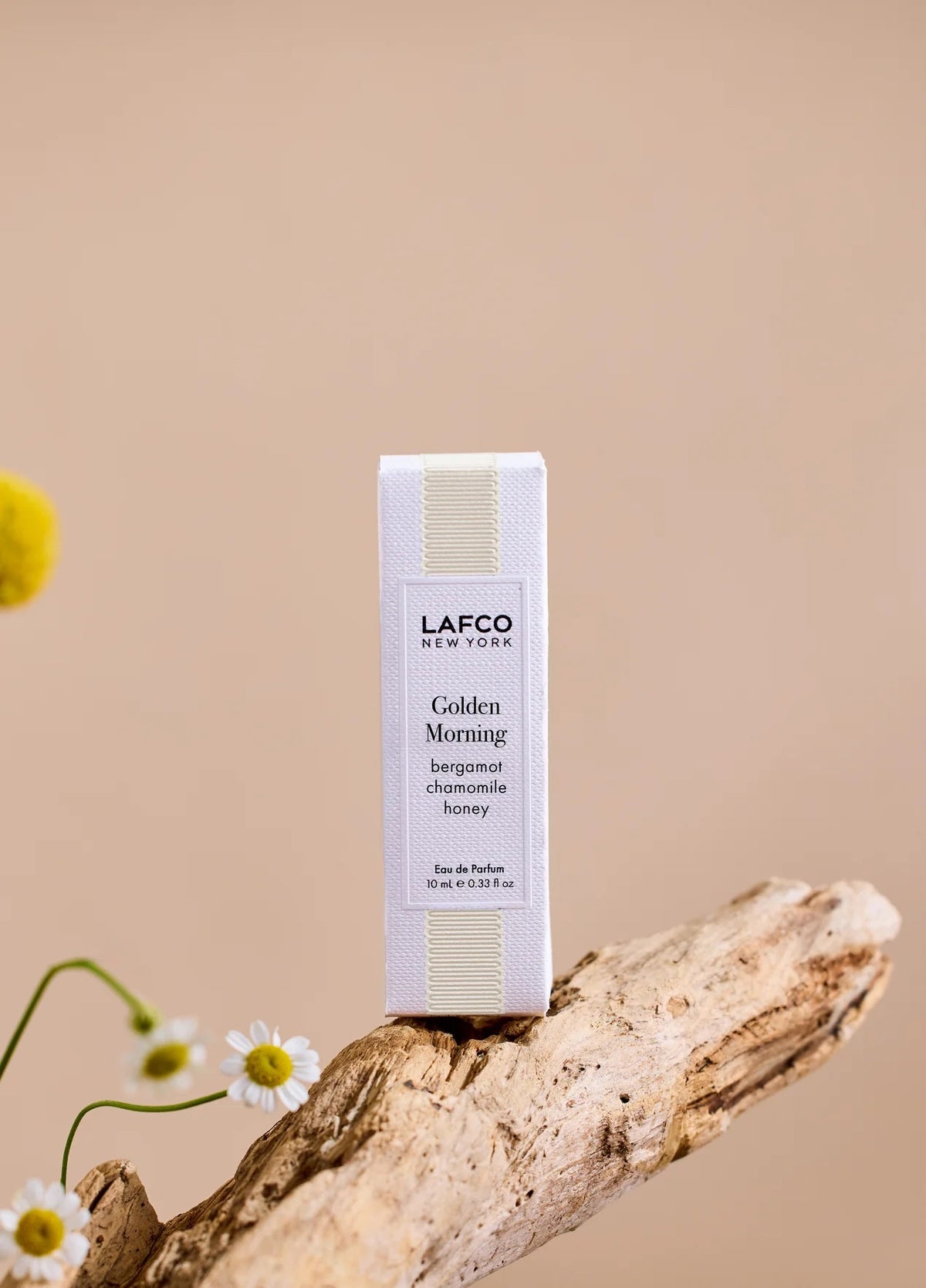 Housed in a clear glass bottle with a beige cap and minimalist black labeling, LAFCO Fine Fragrance Golden Morning 10ml is a floral perfume delicately crafted with essential oils for a fresh, uplifting scent.