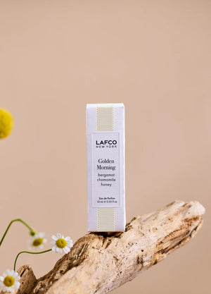 Housed in a clear glass bottle with a beige cap and minimalist black labeling, LAFCO Fine Fragrance Golden Morning 10ml is a floral perfume delicately crafted with essential oils for a fresh, uplifting scent.