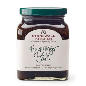 A glass jar of STONEWALL KITCHEN - FIG AND GINGER JAM, featuring a green lid and a white label with product details—ideal for spreading on breakfast breads or infusing marinades and glazes with a sweet-savory flavor.
