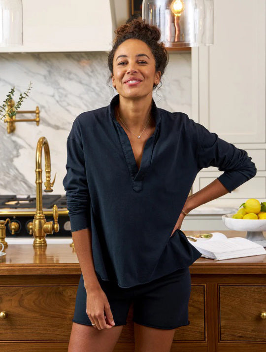 The FRANK &amp; EILEEN Patrick Popover Henley in Heritage Jersey British Royal Navy features a dark blue, long-sleeved design with an open collar and v-neck, set against a light textured background. The soft, slightly wrinkled fabric enhances its relaxed-fit and casual appeal.