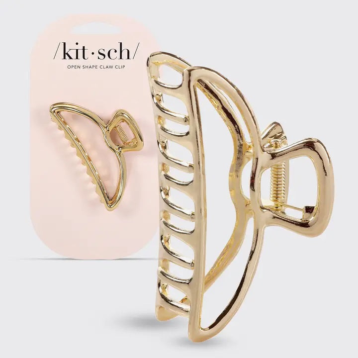 The KITSCH - OPEN SHAPE CLAW CLIP IN GOLD is a minimalist gold metal hair accessory from KITSCH, ideal for styling thick hair and showcased against a plain light background.