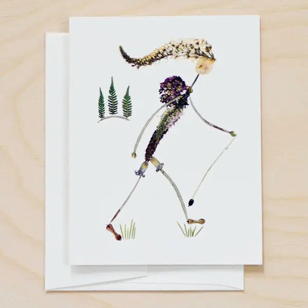 The PETAL PEOPLE PRESS - HIKE CARD by PETAL PEOPLE PRESS features a walking figure crafted from dried flowers and leaves—a unique botanical card perfect for nature lovers.