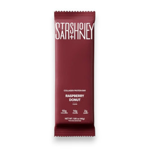 A maroon STARS+HONEY - RASPBERRY DONUT protein bar is shown. This raspberry donut-flavored bar from STARS+HONEY highlights 10g collagen, 14g protein, and only 2g sugar per bar on the front of the package—making it a perfect healthy snack.