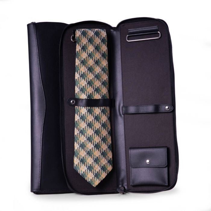A patterned necktie is secured inside a BEYBERK INTERNATIONAL LEATHER TIE TRAVEL CASE with compartments, displayed open on a white background.
