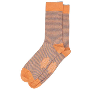 A pair of AMANDA CHRISTENSEN - TRUE STRIPE MID-CALF SOCKS IN ORANGE MELANGE, featuring Italian-made stripes in light brown and orange with solid orange toes, heels, and cuffs, are displayed overlapping on a white background. Expertly crafted by AMANDA CHRISTENSEN from soft combed cotton for enduring comfort and style.