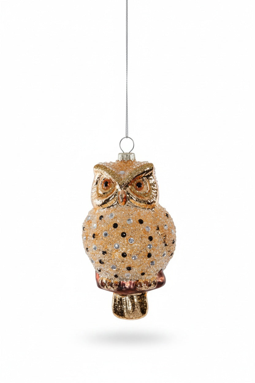 A 2.75 in x 5.5 in GOLDEN OWL GLASS ORNAMENT in glittery gold with sparkling decorative accents.