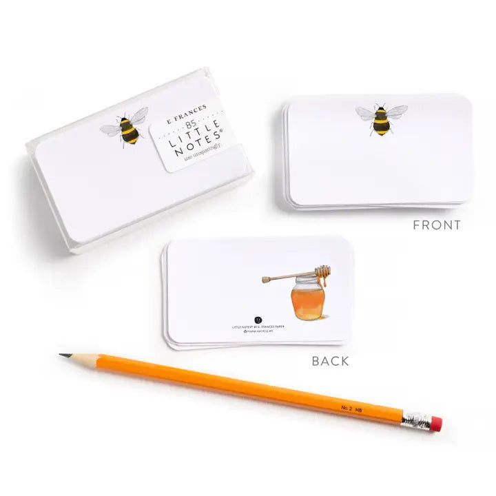 E. FRANCES PAPER’s E. FRANCES - LITTLE NOTES BEES includes 85 mini cards in a clear box, each with a bumblebee design and “E. Frances Little Notes”—perfect for lunch box love, pocket notes, or gift toppers.