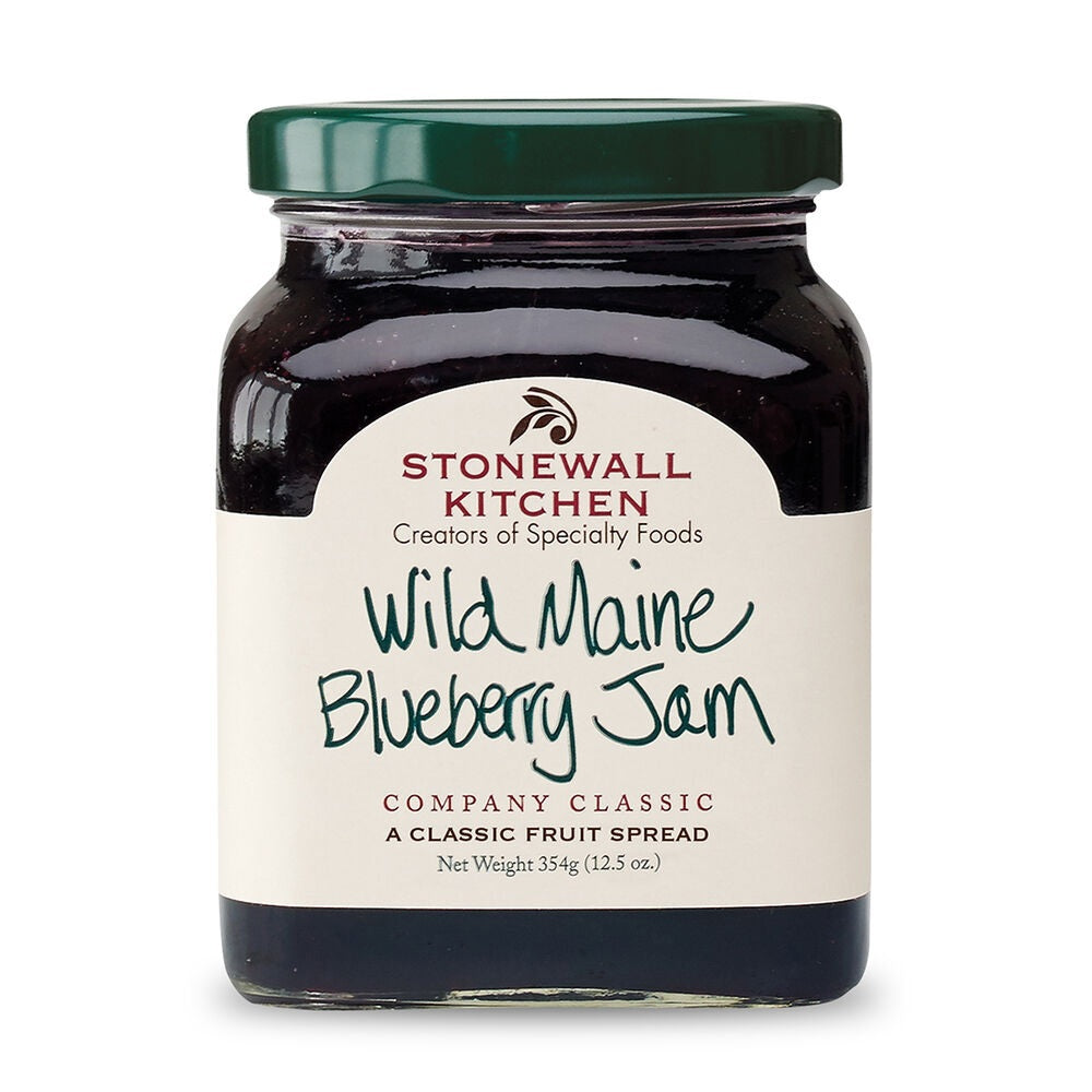 A jar of STONEWALL KITCHEN - WILD MAINE BLUEBERRY JAM contains plump Maine blueberries and comes with a green lid and a cream label featuring handwritten-style text along with the STONEWALL KITCHEN brand details.