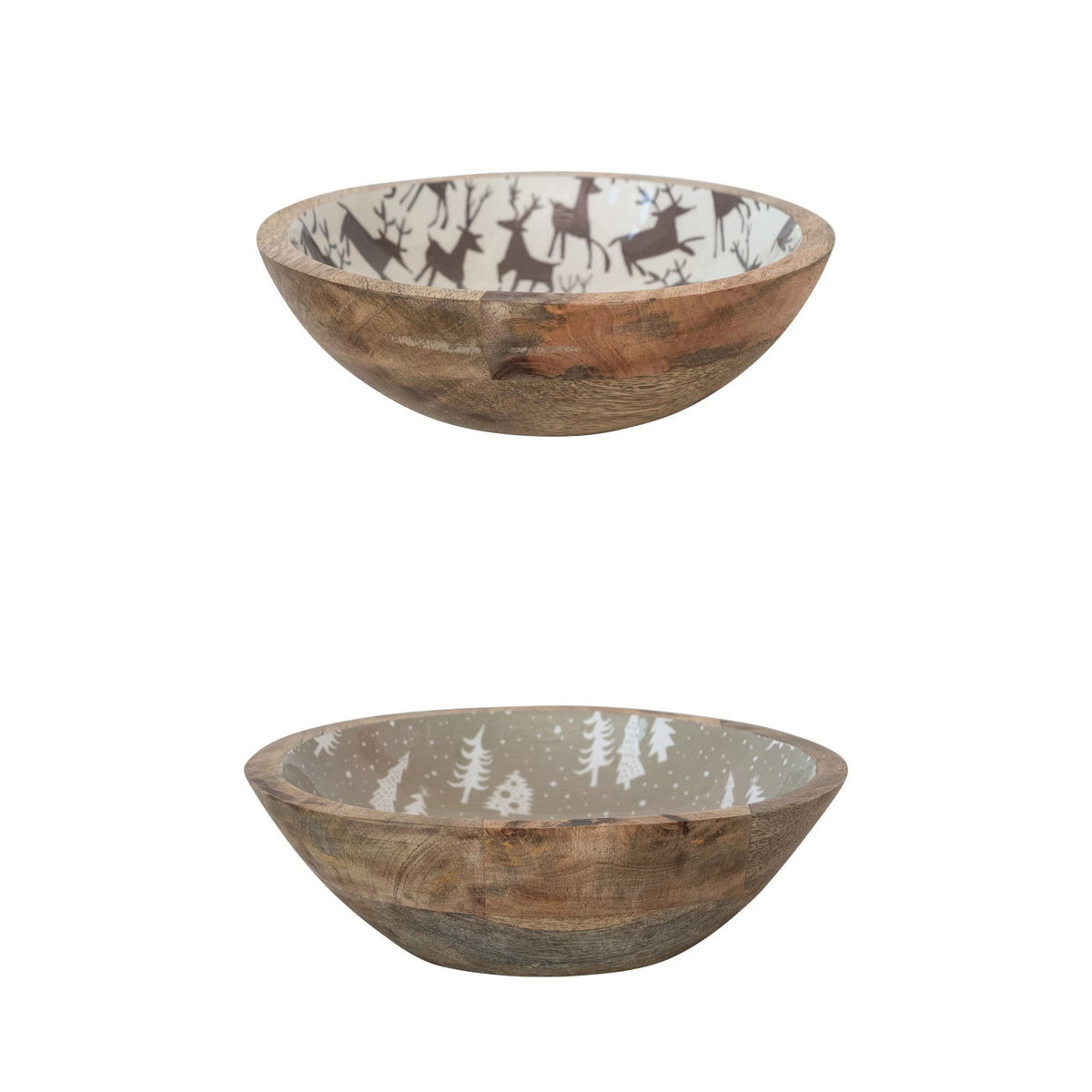 Two CREATIVE COOP MANGO WOOD BOWL WITH HOLIDAY MOTIF are shown: one with brown reindeer inside, the other with white trees and snow-like dots. Both feature a natural mango wood exterior.