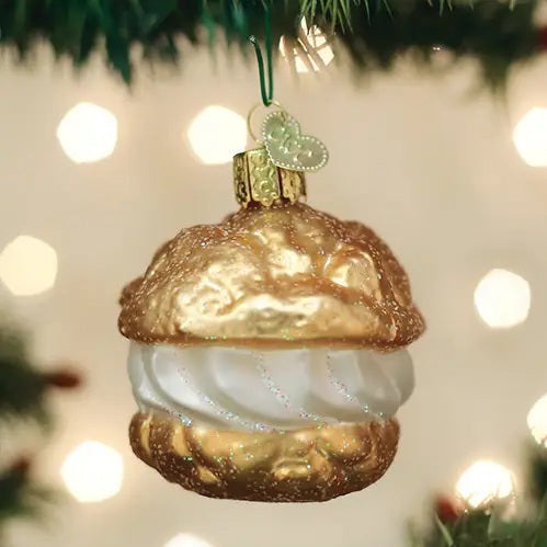 CREAM PUFF ORNAMENT shaped like a choux pastry profiterole with golden shells and a white cream filling.