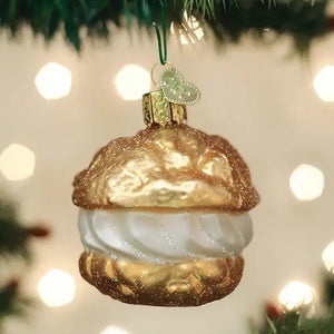 CREAM PUFF ORNAMENT shaped like a choux pastry profiterole with golden shells and a white cream filling.