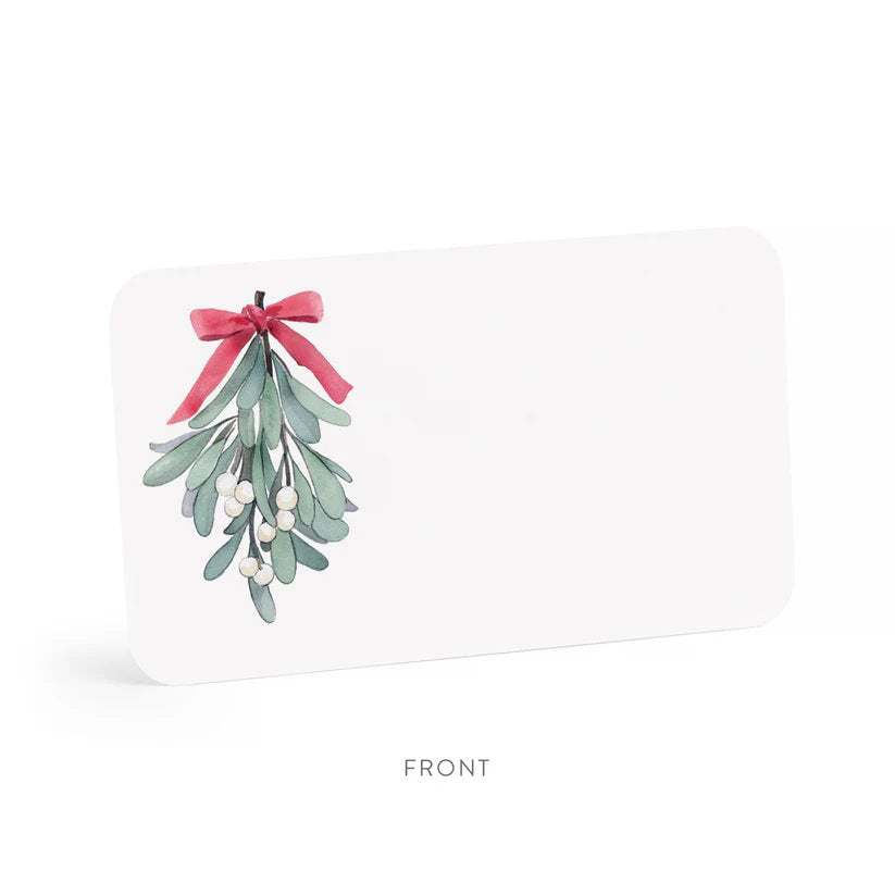 A clear plastic box contains 85 MISTLETOE LITTLE NOTES by E.FRANCES PAPER. The featured card displays a watercolor illustration of mistletoe with green leaves and white berries, beautifully tied with a pink bow. The label states &quot;E. Frances, 85 MISTLETOE LITTLE NOTES, use unsparingly.