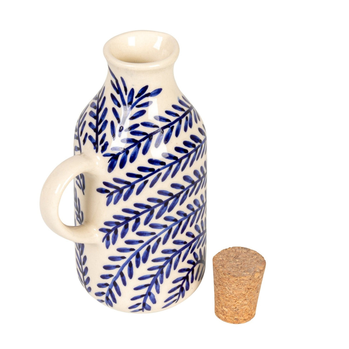 The CREATIVE COOP HAND-PAINTED STONEWARE OIL CRUET WITH CORK STOPPER features blue leaf patterns and a handle, making it a perfect rustic dispenser for adding charm to your farmhouse kitchen decor.