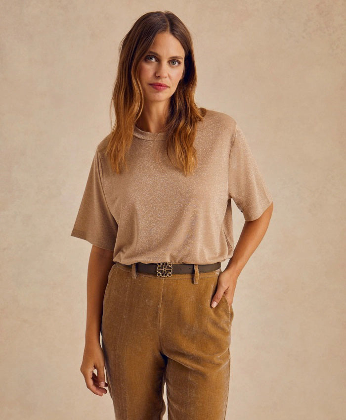 The MOMONI - IORA LUREX JERSEY T SHIRT by MOMONI is a red, short-sleeve, loose-fitting T-shirt with a subtle shimmer. Crafted from soft lurex jersey, this shirt features a round neckline and is made of a soft, lightweight material. Made in Italy. The background is plain white.