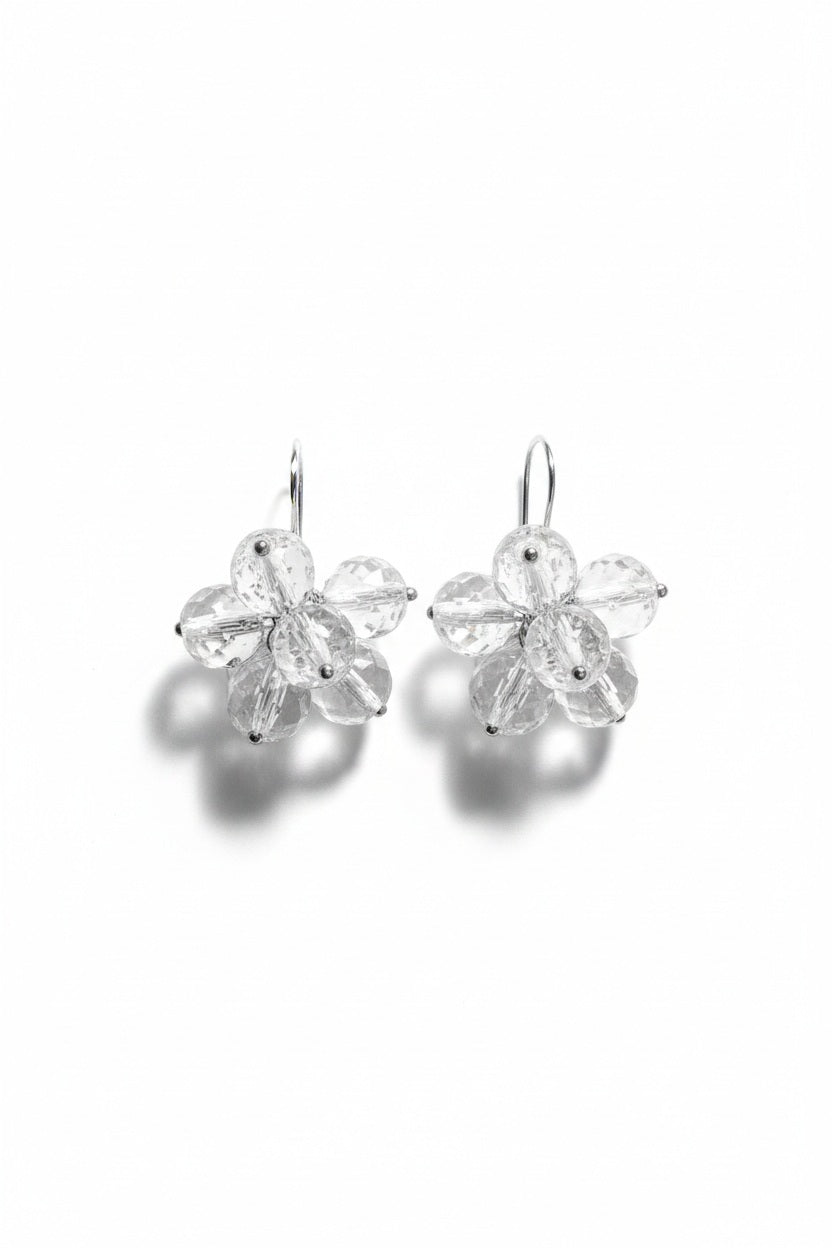 ANN LIGHTFOOT Faceted Quartz Crystal Flower Earrings, featuring delicate blossom shapes crafted from clear, faceted quartz crystal beads and finished with sterling silver hooks, are displayed on a white background.