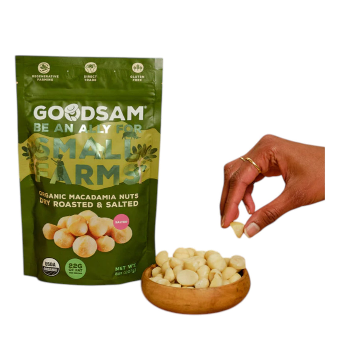 A green resealable bag of GOODSAM FOODS Organic Salted Macadamia Nuts, grown in Kenya, features “Be an ally for small farms,” images of nuts and palm trees, and a nut outside the bag—enjoy their buttery sweetness!.