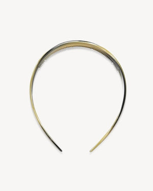 The MACHETE - WIDE HEADBAND IN HORN by MACHETE is lightweight and comfortable, showcasing a marbled pattern in yellow, gray, white, and black tones. Expertly crafted from premium Italian acetate, it is elegantly displayed on a plain white background.