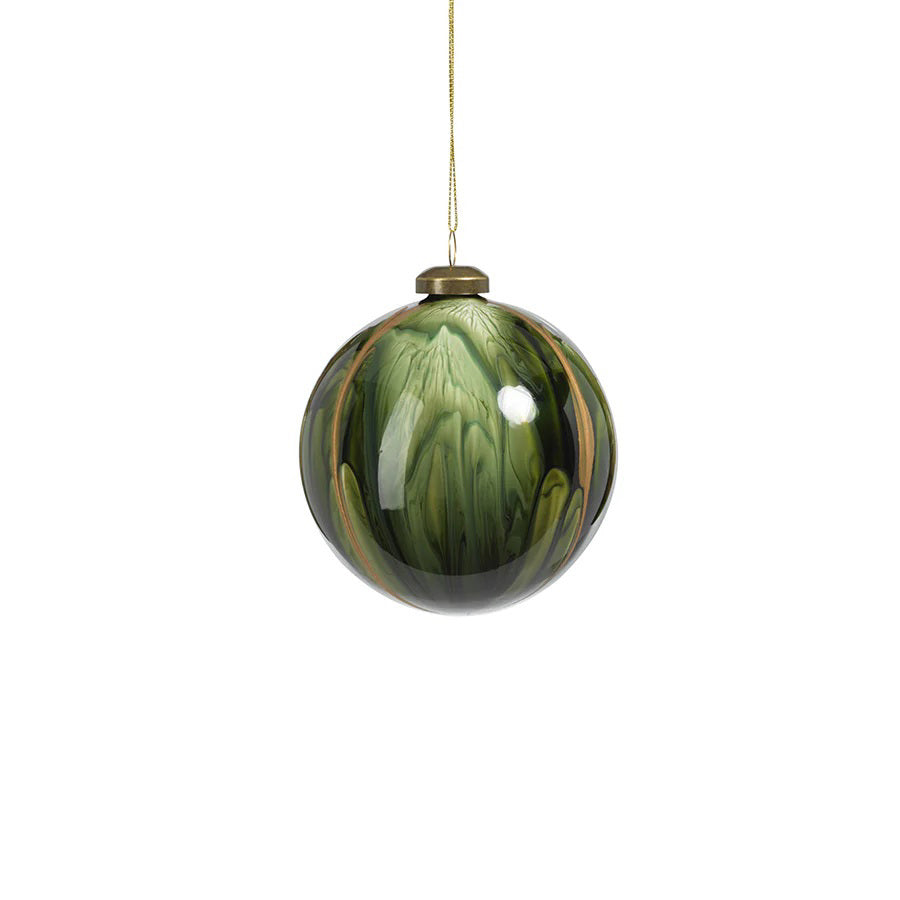 The ZODAX WATER COLOR GLASS ORNAMENT - MEDIUM features a 4-inch round glass design with swirling green and gold patterns, hanging by a thin gold string against a white background.