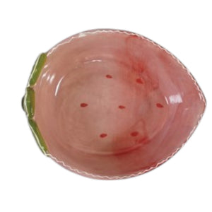 The CREATIVE COOP HAND-PAINTED STONEWARE STRAWBERRY SHAPED BOWL, SMALL features pink glaze, red dots, and a green leaf accent—a decorative piece that adds a sweet touch to your kitchen or tableware.