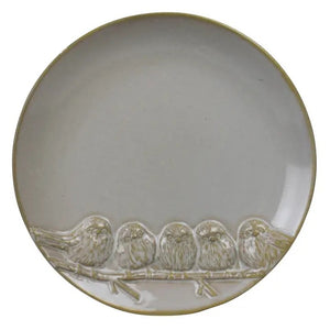 The HOMART CERAMIC TRAY WITH 5 BIRDS is a round, light gray ceramic tray featuring five embossed birds on a branch. Food safe and 8" in diameter, it’s perfect as a charming hostess gift.