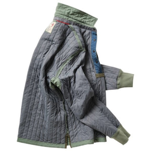 The RELWEN Polo-Jack in Muted Olive, a long-sleeve quilted technical popover featuring a chest pocket, buttoned collar, and cuffs, is shown laying flat on a white background.
