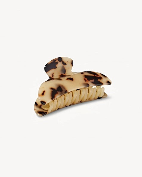 The MACHETE - MIDI HEIRLOOM CLAW by MACHETE is featured against a plain white background. This cream-colored hair accessory is crafted from luxurious Italian acetate and features curved edges with interlocking teeth, making it ideal for securing medium hair with effortless style.