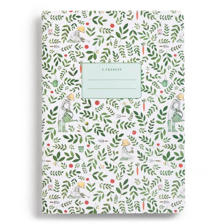 The E. FRANCES PAPER STITCHED NOTEBOOKS GARDENER, SET OF 2, featuring a green and white checkered cover, is open on a white surface next to two striped pencils—one green and one pink—with the right page blank.