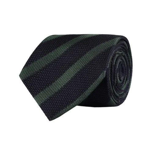 The AMANDA CHRISTENSEN Striped Jacquard Woven Silk Tie in Green showcases refined Italian craftsmanship with diagonal black and dark green stripes on a crisp white background, making it a sophisticated accessory that enhances any gentleman’s wardrobe.
