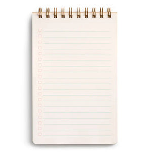 A close-up of the E. FRANCES - TASK PAD BEE by E. FRANCES PAPER shows a spiral-bound notebook with checkboxes on the left and light blue ruled lines, mostly blank, against a white background.