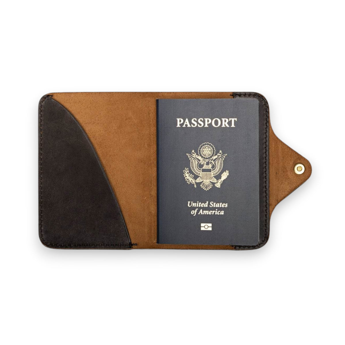 The WP STANDARD - Leather Passport Holder in black full-grain leather features edge stitching and a brass snap closure, offering a stylish way to carry your passport, shown closed against a white background.