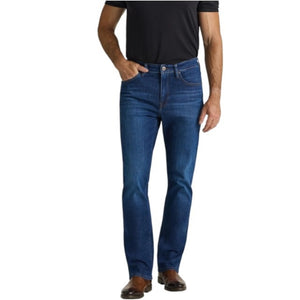 A person is shown from the back wearing a black shirt and the 34 HERITAGE - CASH BOOTCUT JEANS IN DARK BRUSHED VINTAGE by 34 HERITAGE. The vintage denim features back pockets and a black leather patch on the waistband, with the wearer’s arms visible.