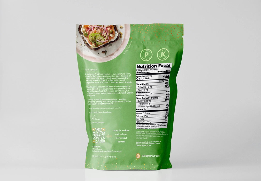 The image features a green bag of STRUESLI - SAVORY SEED GRANOLA with white and orange text. The front highlights key ingredients and attributes, including tiger nuts and pumpkin seeds, noting that it contains no sweeteners and is chef-crafted. It also prominently displays its gluten-free, Paleo certifications, and keto-friendly nature.
