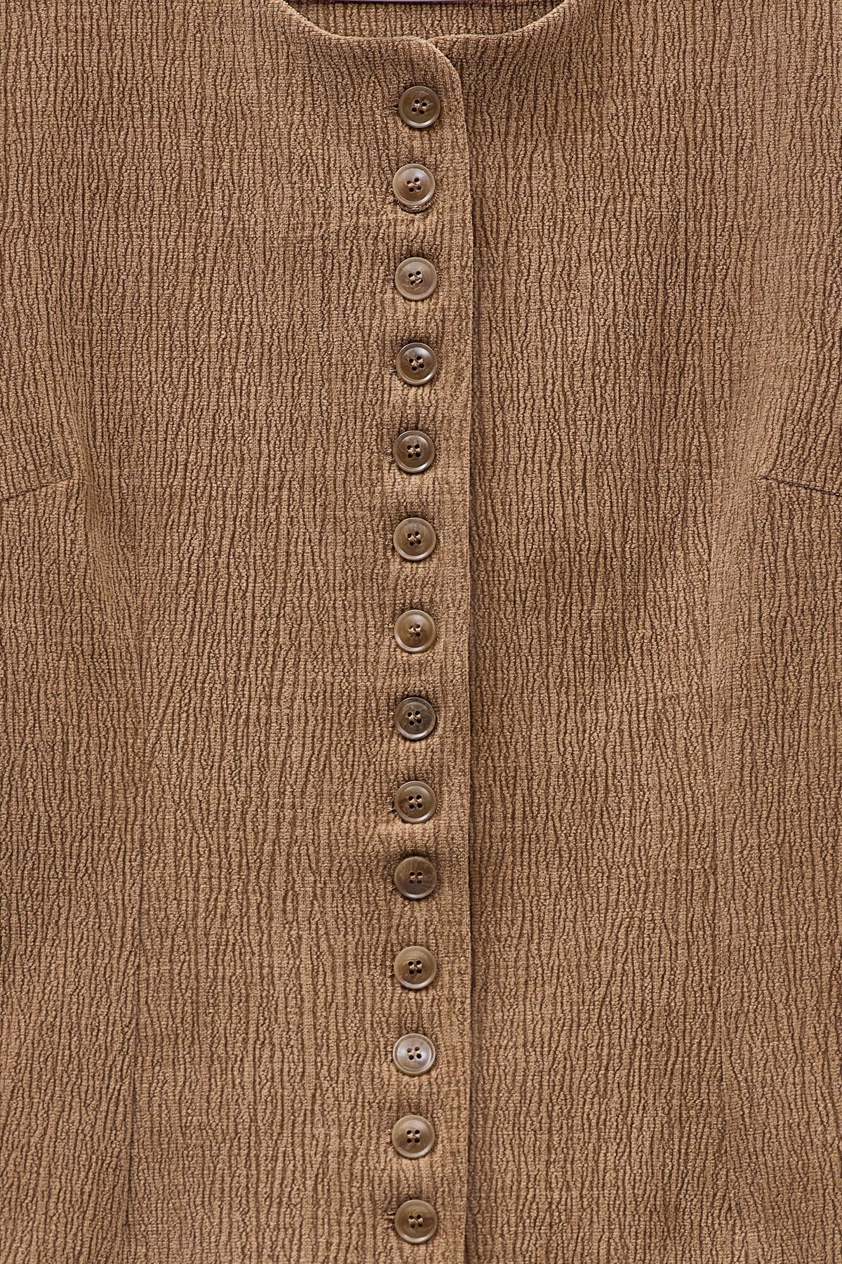 ELEH - THE ATLIER VEST by ELEH: A sleeveless, textured brown crinkle fabric vest with a round neckline and small front buttons, shown against a white background.