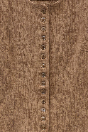 ELEH - THE ATLIER VEST by ELEH: A sleeveless, textured brown crinkle fabric vest with a round neckline and small front buttons, shown against a white background.