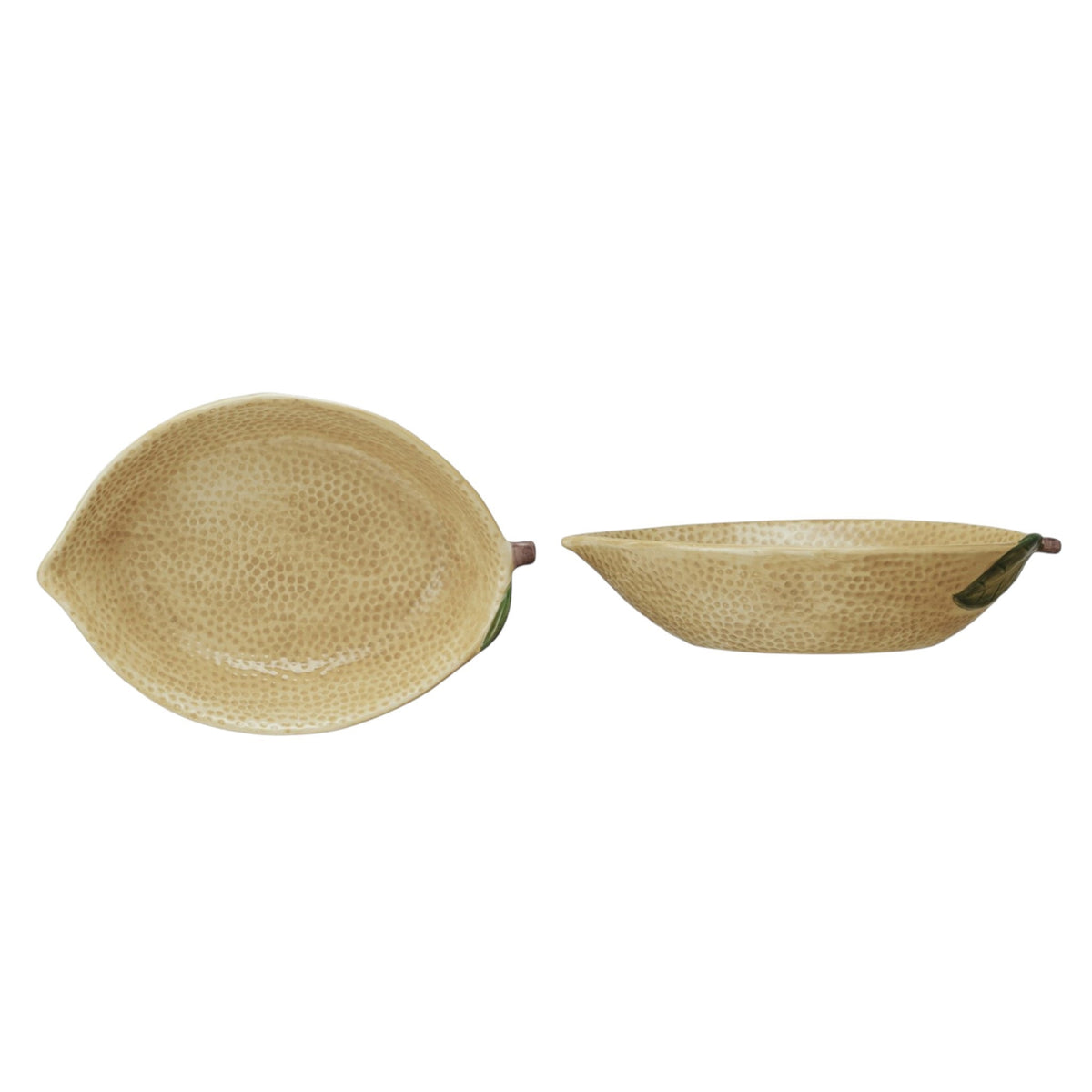 The CREATIVE COOP HAND-PAINTED STONEWARE LEMON SHAPED BOWL, LARGE features a textured yellow finish with a green leaf accent, making it a perfect decorative citrus bowl.