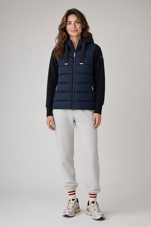 SAVE THE DUCK - PRISKA PUFFER JACKET IN BLUE BLACK hooded hybrid jacket featuring a dark blue quilted body, black sleeves, and a front zipper for transitional weather.