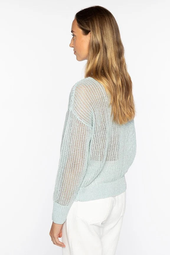 The KINROSS CASHMERE Open Texture Lurex Crew Neck Linen Sweater by KINROSS features light beige ribbed knit, long sleeves, dropped shoulders, relaxed fit, and openwork stitch design—shown against a plain white background.