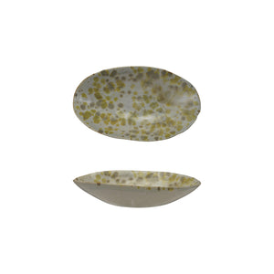 The CREATIVE COOP STONEWARE DISH features an oval ceramic design with a white base and yellow-green speckles from a reactive glaze. Shown top and side, these unique pieces add handcrafted charm to your kitchen decor.