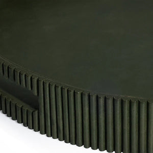 Close-up of the ZODAX ROUND FLUTED LEATHER TRAY IN GREEN, showcasing a smooth top and vertical, evenly spaced ridges on the sides for a modern, textured look.