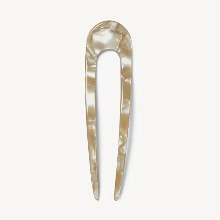 A smooth, black MACHETE - FRENCH HAIR PIN with two prongs, crafted from Italian acetate by MACHETE, rests on a plain white surface.
