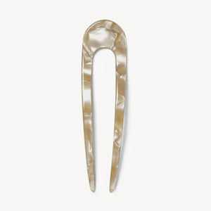 A smooth, black MACHETE - FRENCH HAIR PIN with two prongs, crafted from Italian acetate by MACHETE, rests on a plain white surface.
