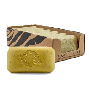 The BAUDELAIRE See Loofa Bath Soap 5oz is a rectangular beige bar with seaweed powder speckles and an elegant floral center, ideal for exfoliation and a refreshing cleanse.