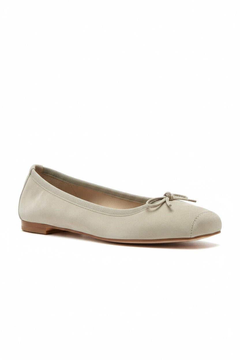 The MICHELE LOPRIORE - PALOMA BALLET FLAT WITH SQUARE TOE is a metallic silver leather shoe made in Italy, with a small bow on the rounded toe, low brown heel, and smooth texture, shown against a plain light background.