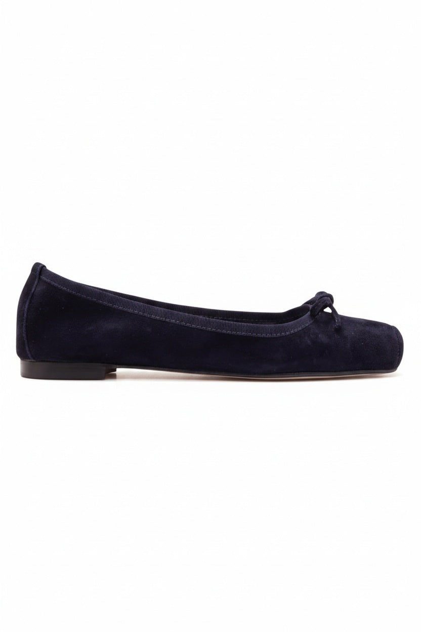 The MICHELE LOPRIORE - PALOMA BALLET FLAT WITH SQUARE TOE is a metallic silver leather shoe made in Italy, with a small bow on the rounded toe, low brown heel, and smooth texture, shown against a plain light background.