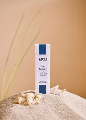 A clear glass perfume bottle labeled “LAFCO - FINE FRAGRANCE, BARE SUMMER 10ML” from LAFCO, topped with a turquoise marbled cap, this essential oil fragrance features an elegant blend that’s both refreshing and modern.