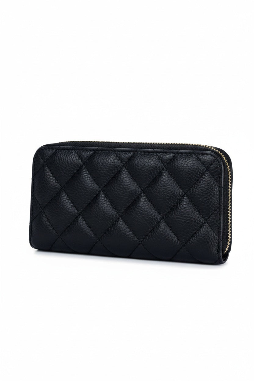 A light blue LE BORSETTE LEATHER QUILTED WALLET with diamond stitching on a white background features a zip-around closure, gold zipper pull, and multiple card slots.