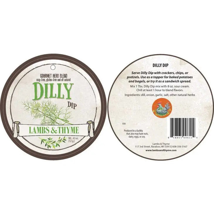A round label for &quot;LAMBS &amp; THYME - DILLY DIP&quot; featuring an illustration of dill and the text &quot;LAMBS &amp; THYME&quot; is displayed in the foreground. The label emphasizes that it is free from MSG, gluten, and GMOs. In the background, there is a white container with a parsley plant growing out of it.