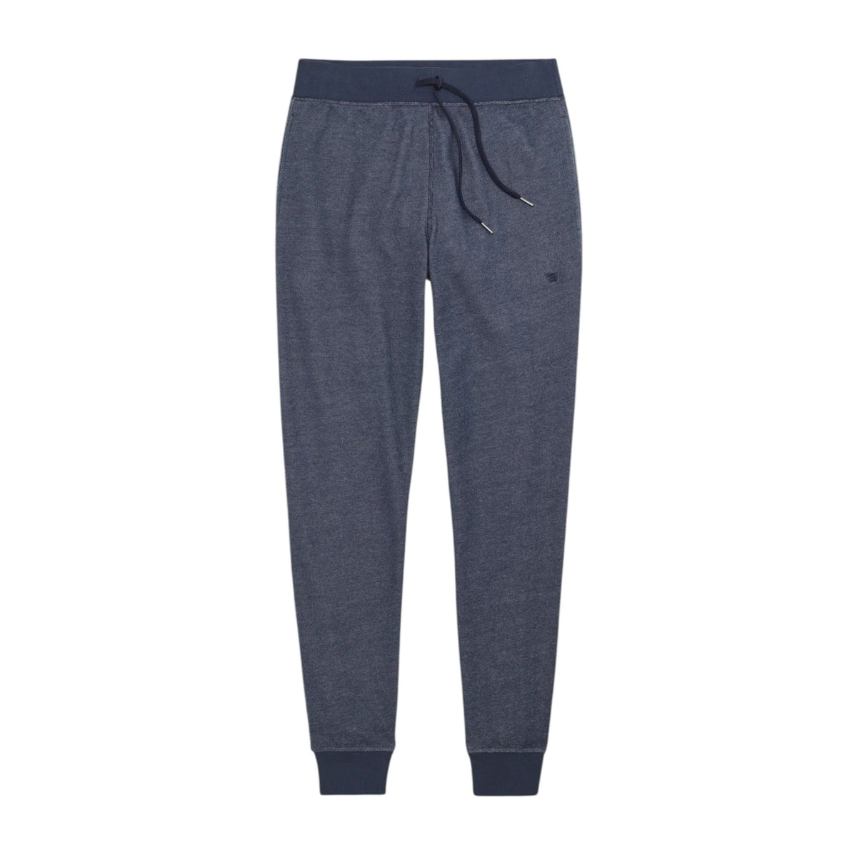 A person wears MACK WELDON ACE Relaxed Fit Sweatpants in True Navy - Bird’s Eye, styled with pockets and matching navy sneakers, against a plain light gray background. Only the lower body is visible.